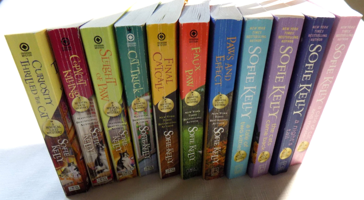 Lot of 11 Paperback Books in the Magical Cats Mystery Series by Sofie Kelly
