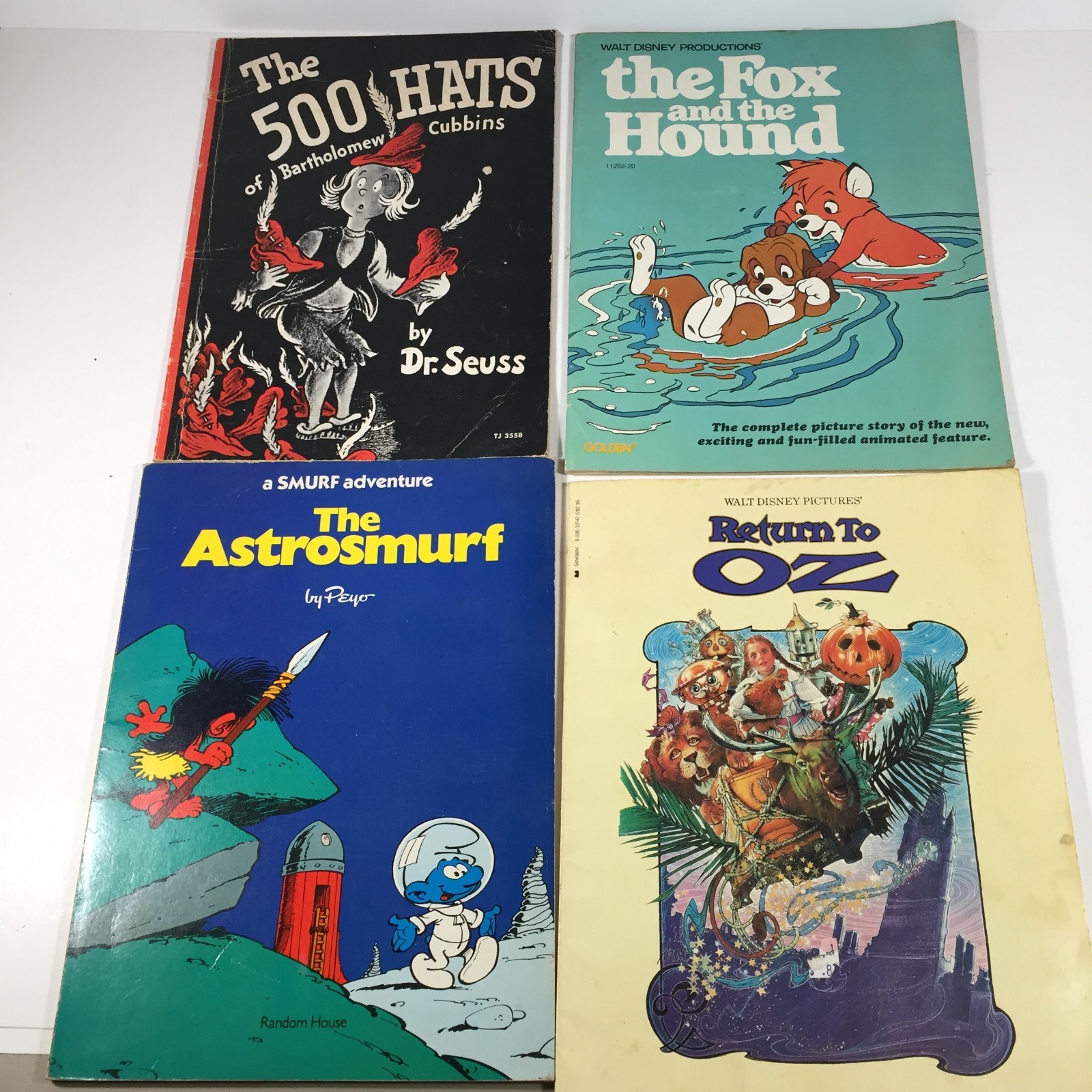 Lot of 4 Paperback Childrens Books-Dr. Seuss 500 Hats, Smurfs, Fox & Hound, Oz