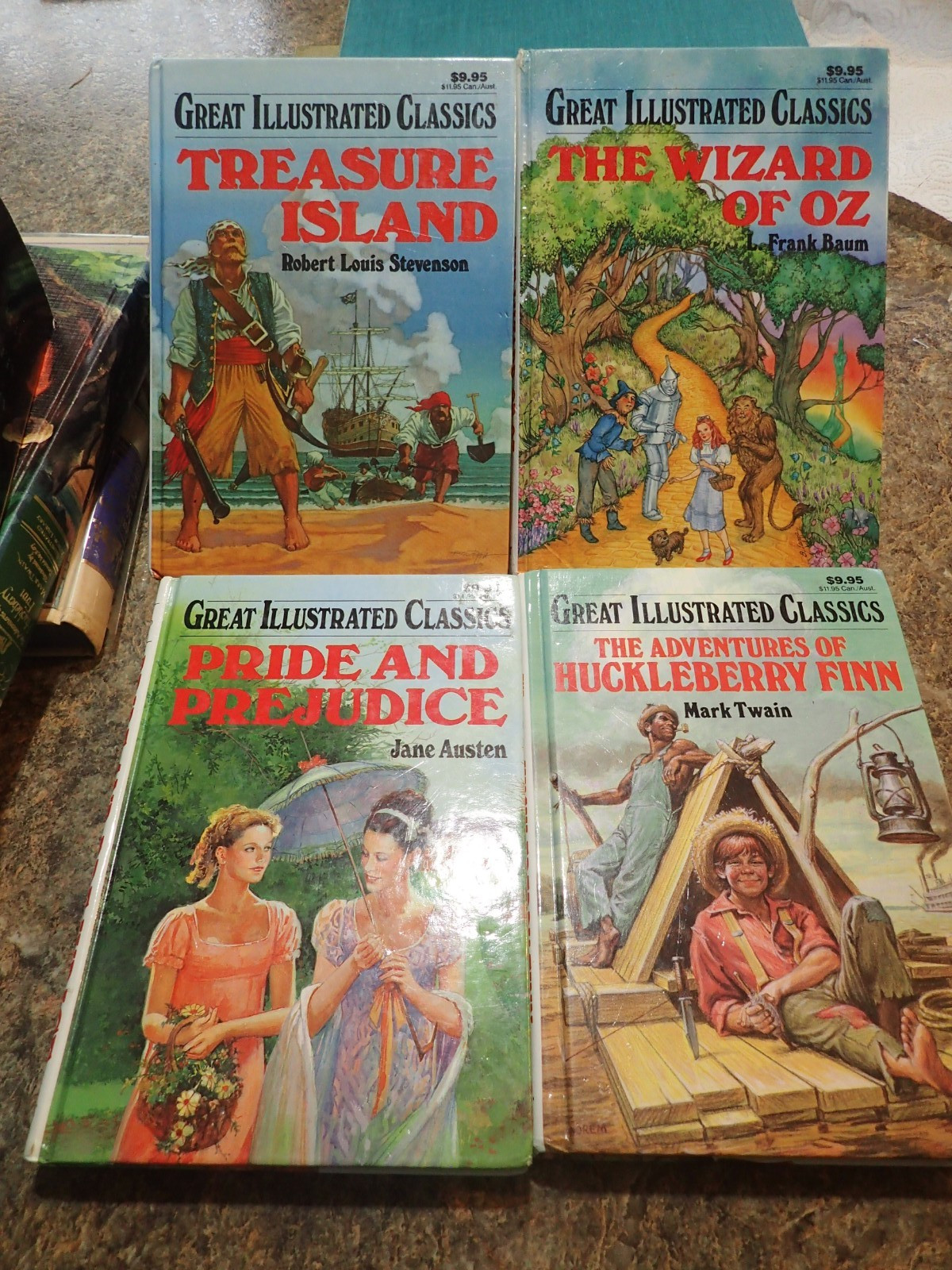 4 BOOK LOT Great Illustrated Classics hardcovers Oz Huckleberry Finn Treasure